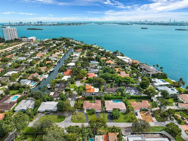 aerial view featuring a city view and a water view