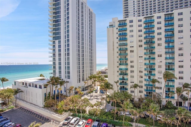 view of building exterior featuring a view of city and a water view