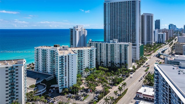 birds eye view of property featuring a water view and a view of city