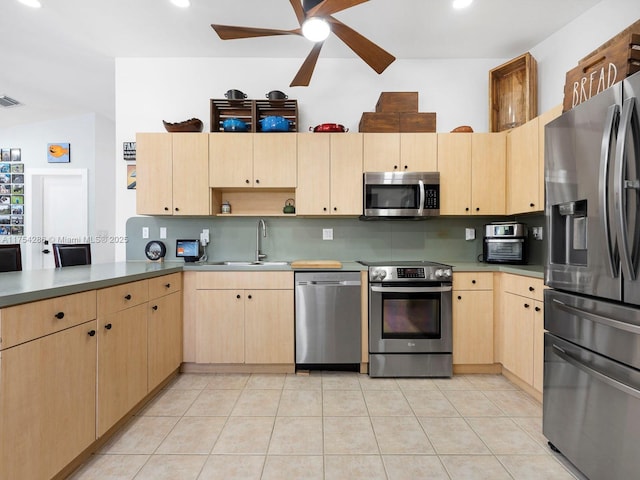 kitchen featuring light brown cabinets, stainless steel appliances, a sink, decorative backsplash, and open shelves