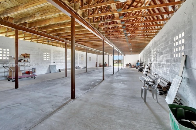 interior space with unfinished concrete flooring