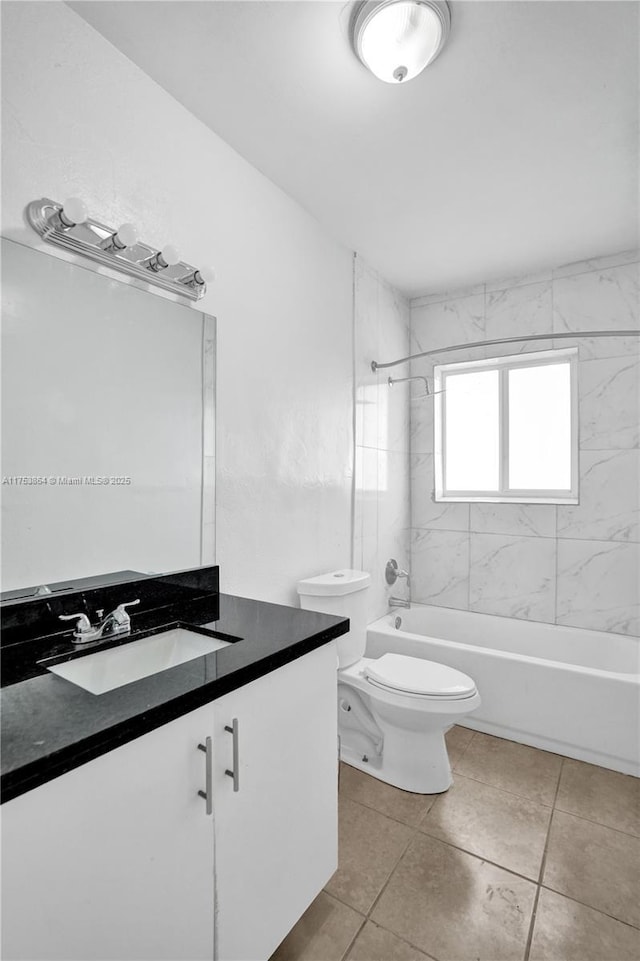 bathroom with shower / bath combination, tile patterned floors, toilet, and vanity