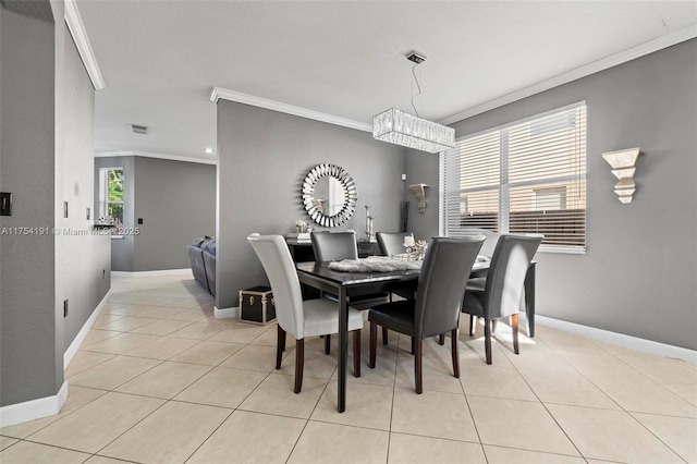 dining room with light tile patterned flooring, crown molding, visible vents, and baseboards