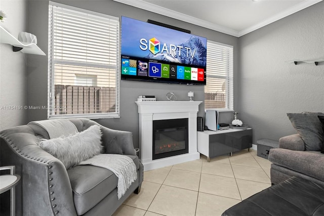 tiled living room featuring ornamental molding and a glass covered fireplace