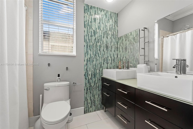 full bathroom with toilet, a shower with curtain, tile patterned flooring, crown molding, and vanity