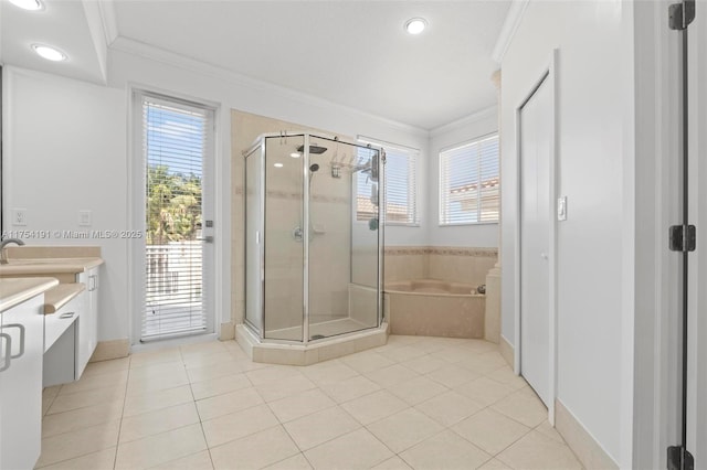 bathroom featuring a garden tub, a shower stall, ornamental molding, and vanity