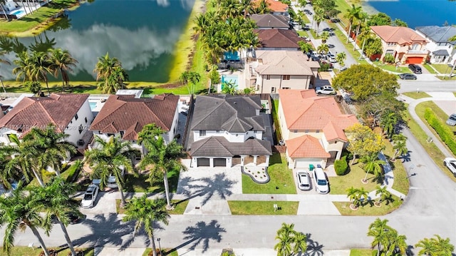 bird's eye view with a water view and a residential view