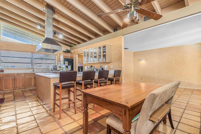 dining space featuring a ceiling fan, wood ceiling, lofted ceiling with beams, and light tile patterned floors