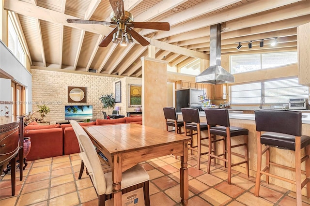 dining space with lofted ceiling with beams, ceiling fan, a toaster, wood ceiling, and track lighting