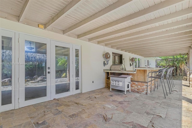 view of patio with french doors and outdoor dry bar