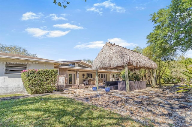 rear view of property with stucco siding