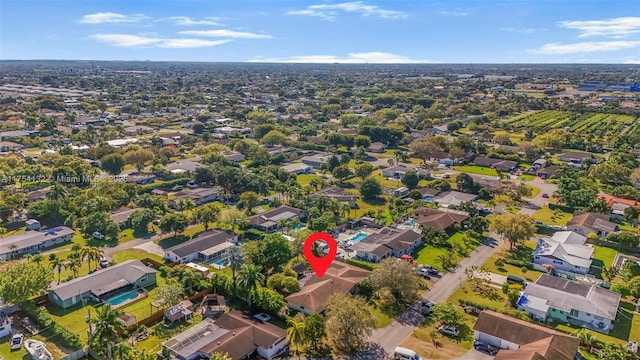 birds eye view of property with a residential view