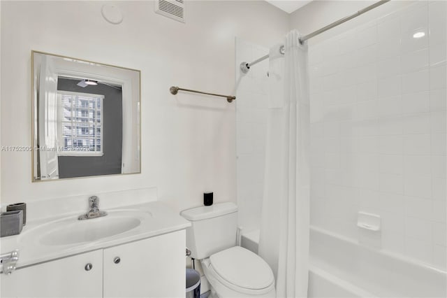 bathroom with shower / bathtub combination with curtain, visible vents, vanity, and toilet