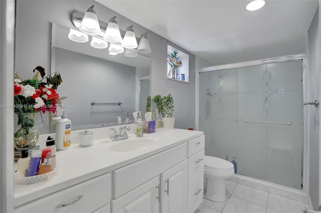 full bathroom featuring toilet, a stall shower, tile patterned flooring, and vanity