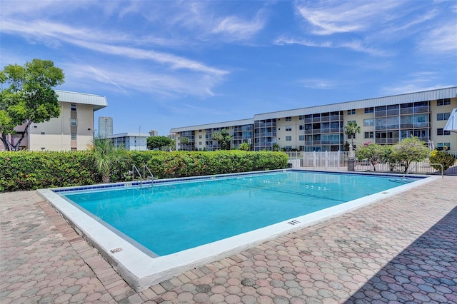 community pool featuring fence