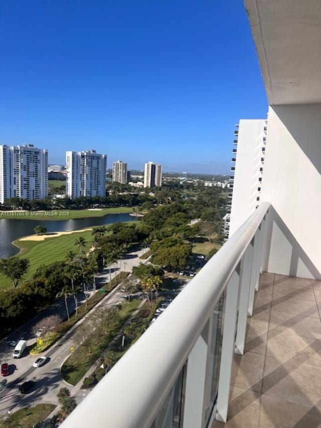 balcony with a water view and a city view