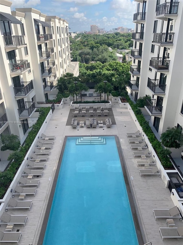 view of pool with a view of city