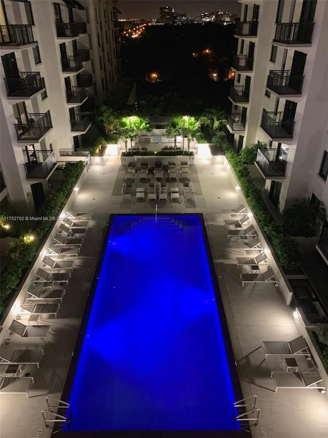 view of pool at night