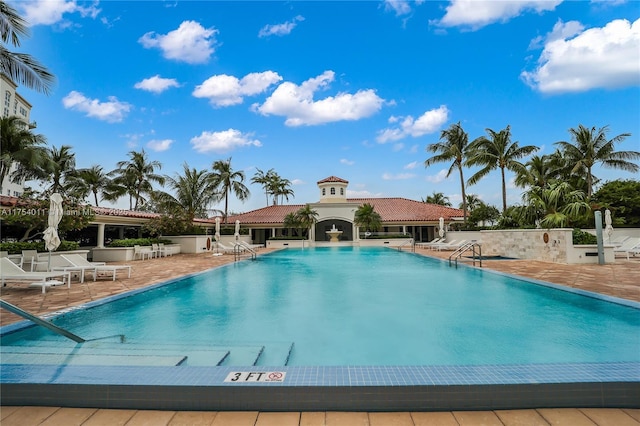 community pool featuring a patio area