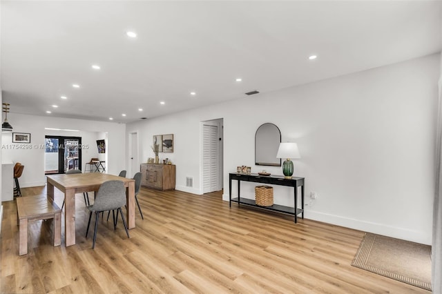 dining area with recessed lighting, visible vents, light wood-style flooring, and baseboards