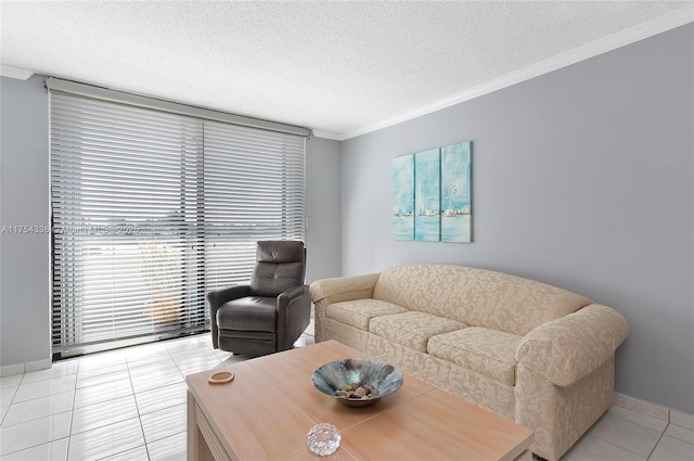 living area with crown molding, a textured ceiling, baseboards, and light tile patterned floors