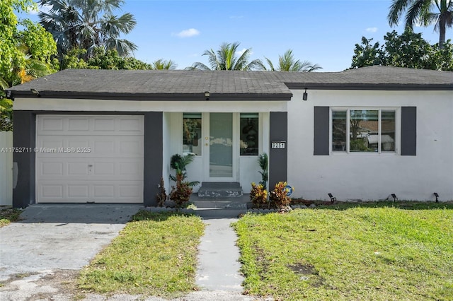 ranch-style house featuring concrete driveway, a front yard, an attached garage, and stucco siding