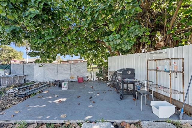 view of patio / terrace featuring a fenced backyard and a grill