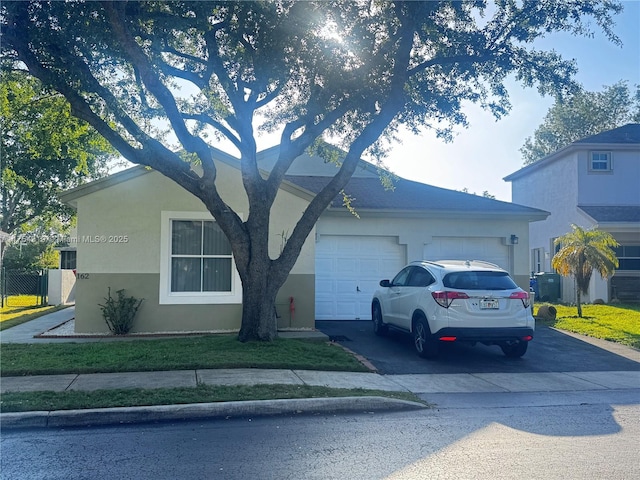 162 NW 207th Ave, Pembroke Pines, FL 33029 - view of front of home featuring asphalt driveway, an attached garage, stucco siding, and central AC unit