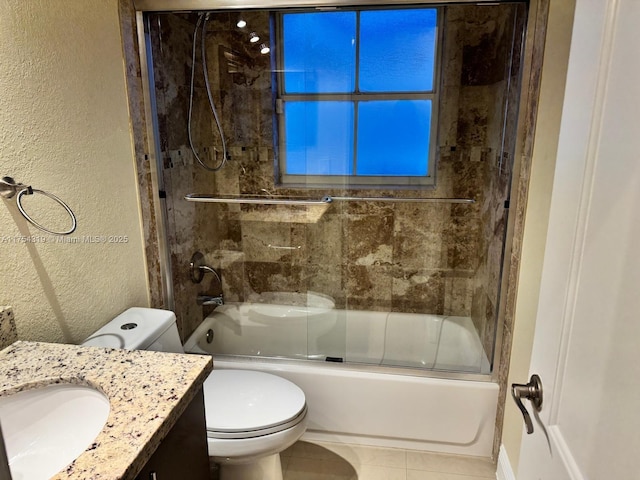 162 NW 207th Ave, Pembroke Pines, FL 33029 - bathroom with vanity, toilet, a textured wall, bath / shower combo with glass door, and tile patterned floors