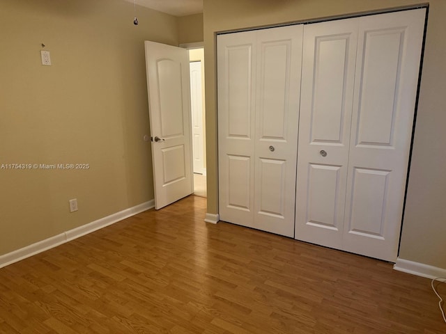 162 NW 207th Ave, Pembroke Pines, FL 33029 - unfurnished bedroom featuring baseboards, light wood-type flooring, and a closet