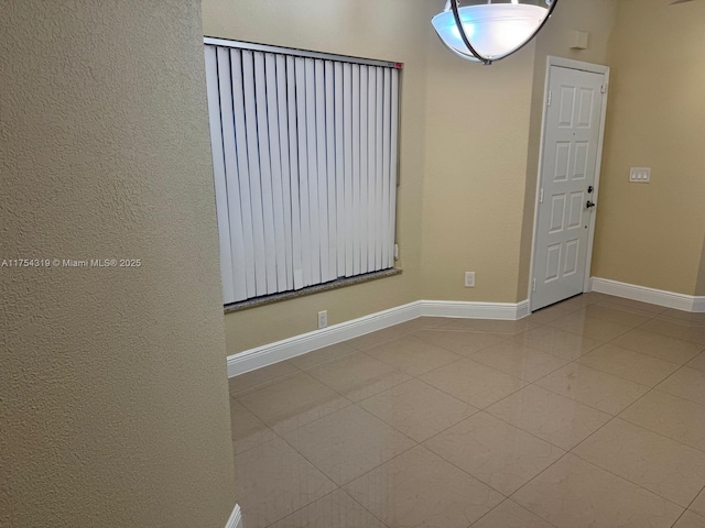 162 NW 207th Ave, Pembroke Pines, FL 33029 - tiled spare room with baseboards