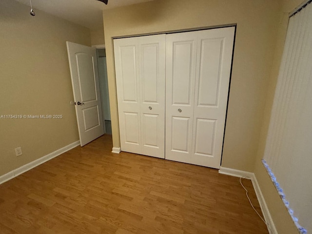 162 NW 207th Ave, Pembroke Pines, FL 33029 - unfurnished bedroom with light wood-style floors, baseboards, and a closet