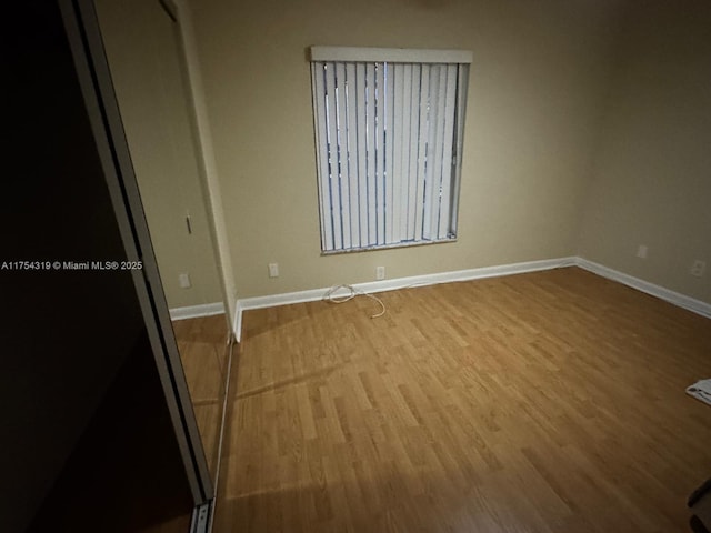162 NW 207th Ave, Pembroke Pines, FL 33029 - empty room with wood finished floors and baseboards