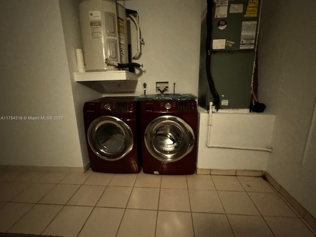 162 NW 207th Ave, Pembroke Pines, FL 33029 - laundry room with washer and dryer, light tile patterned flooring, water heater, and baseboards