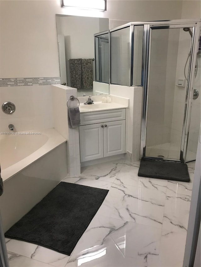 16654 SW 103rd Ln, Miami, FL 33196 - full bathroom featuring marble finish floor, a garden tub, a shower stall, and vanity
