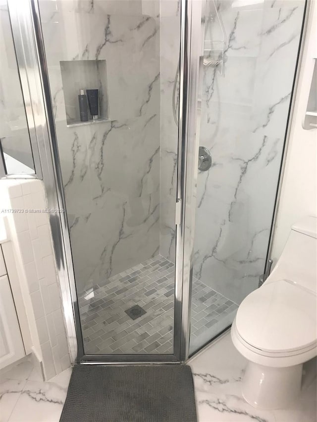 16654 SW 103rd Ln, Miami, FL 33196 - full bathroom with marble finish floor, toilet, and a marble finish shower