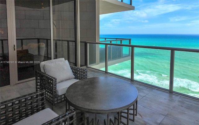 balcony featuring a water view