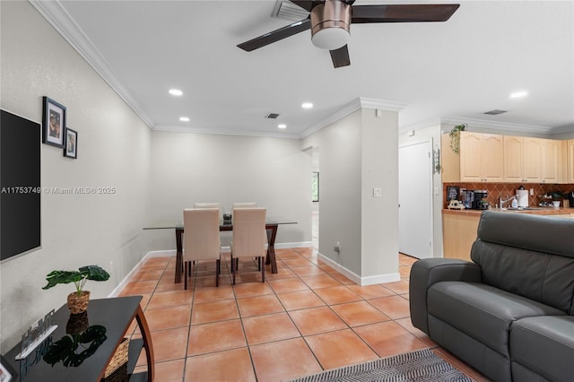 living area with visible vents, baseboards, light tile patterned flooring, crown molding, and recessed lighting