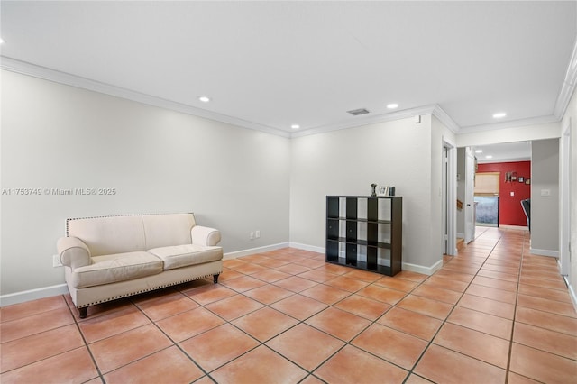 sitting room featuring baseboards, crown molding, and recessed lighting