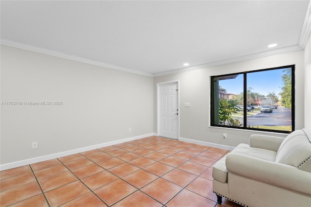 sitting room featuring recessed lighting, crown molding, and baseboards