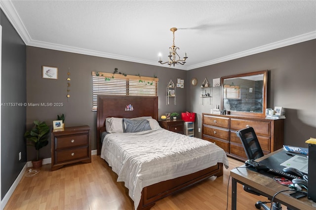 bedroom with ornamental molding, light wood finished floors, baseboards, and an inviting chandelier