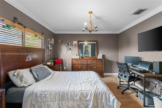 bedroom featuring an inviting chandelier, light wood-type flooring, visible vents, and crown molding