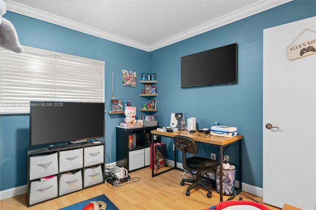 office space with ornamental molding, a textured ceiling, baseboards, and wood finished floors