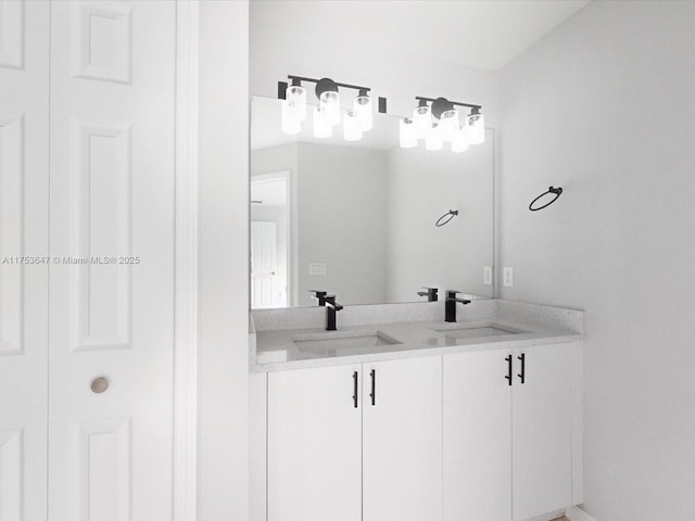 full bath with double vanity and a sink