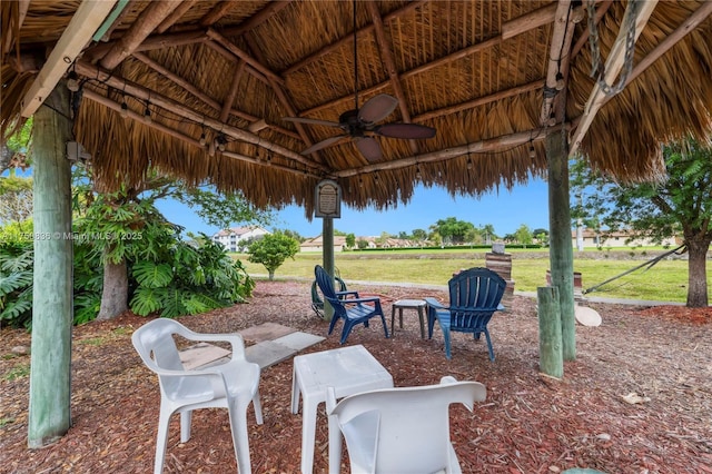 view of patio / terrace featuring ceiling fan and a gazebo