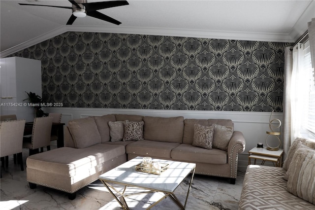 living area featuring vaulted ceiling, marble finish floor, ornamental molding, and a wealth of natural light