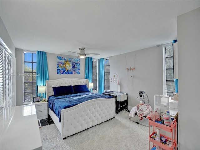 carpeted bedroom with a ceiling fan