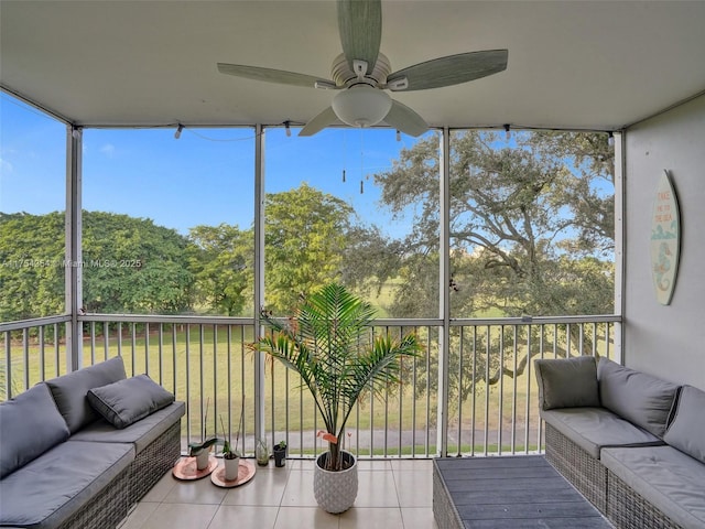 sunroom with a ceiling fan and a healthy amount of sunlight