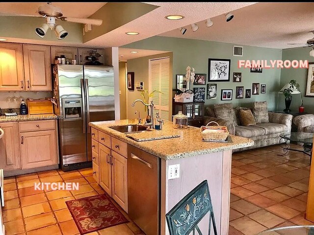 1350 S Fieldlark Ln, Homestead, FL 33035 - kitchen with appliances with stainless steel finishes, ceiling fan, open floor plan, a sink, and light tile patterned floors