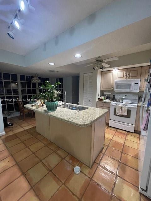 1350 S Fieldlark Ln, Homestead, FL 33035 - kitchen featuring white appliances, a sink, an island with sink, light tile patterned floors, and light stone counters